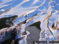 航拍塔克拉瑪干沙漠雪景 宛若童話世界